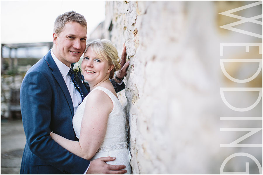 A relaxed portrait of a bride and groom at their wedding at The Star Inn in Harome near Helmsley in North Yorkshire