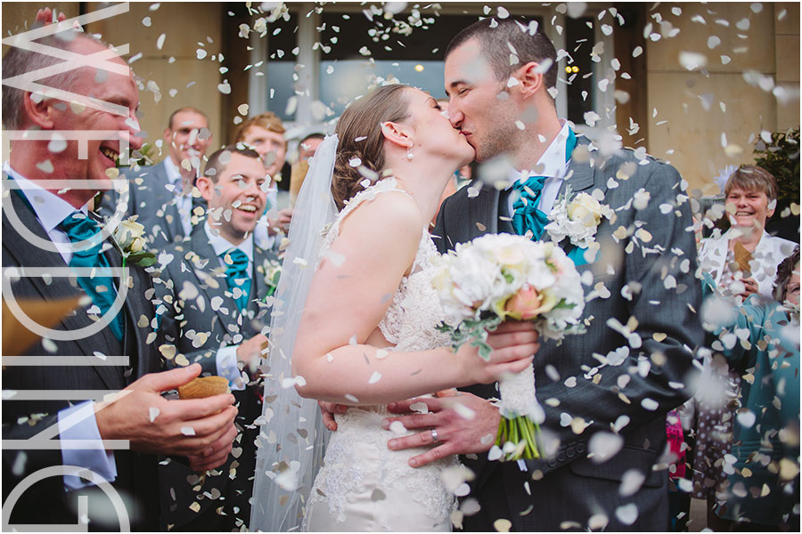 A wedding photo of confetti being thrown at a wedding at The Mansion in Roundhay Park in Leeds in Yorkshire
