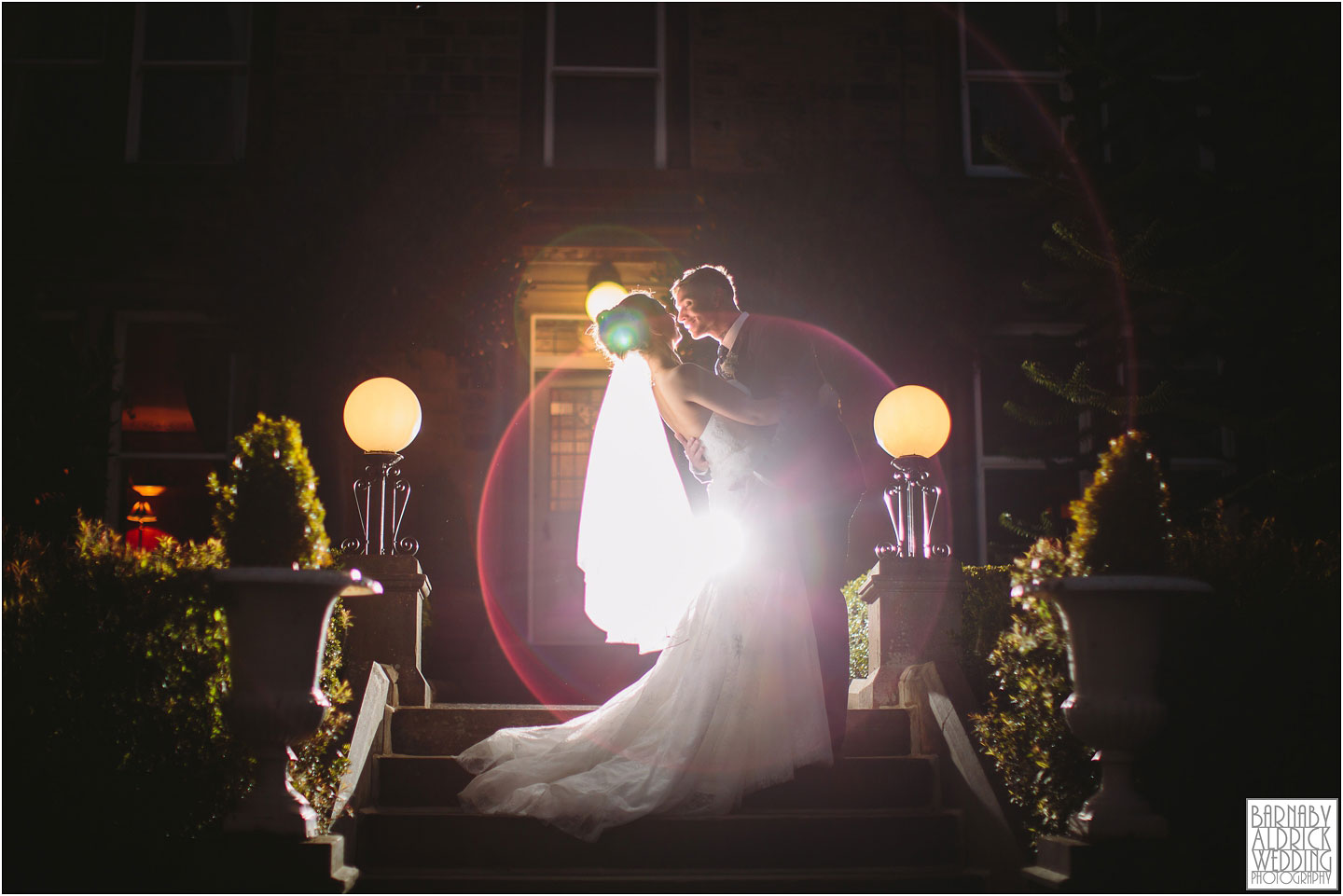 A bride and groom kiss in the evening at Crow Hill wedding venue in Marsden in Yorkshire