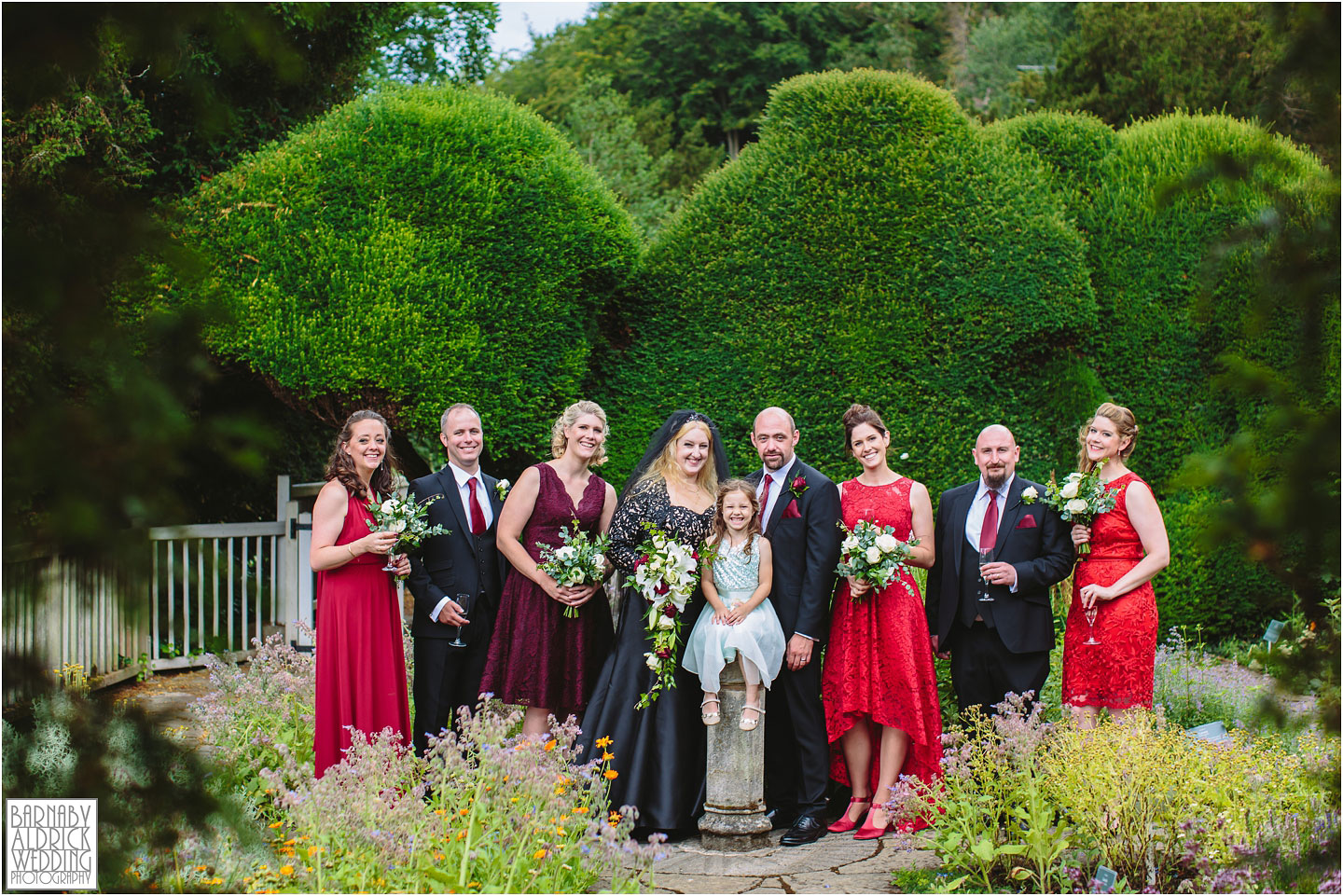 A wedding party group photo at Fountains Abbey Herb Garden