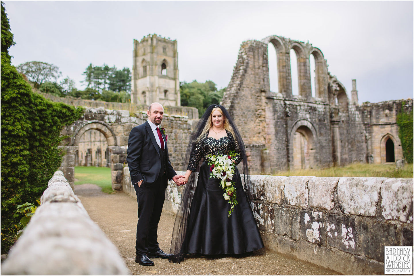 A wedding portrait photograph in the ruins of The National Trust's Fountains Abbey