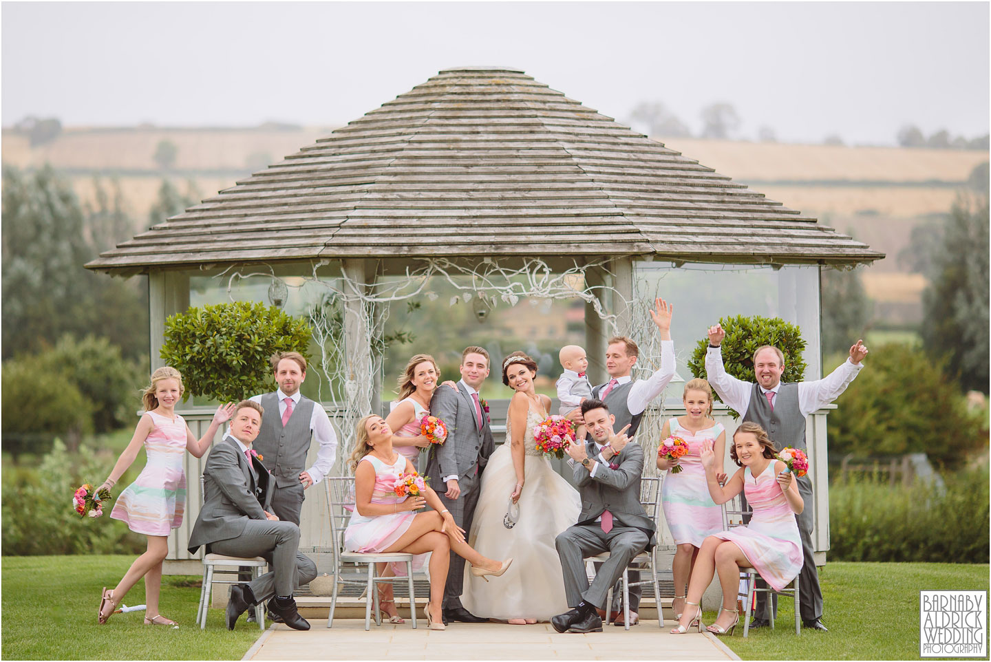 Bridesmaids and groomsmen fun group shot at Yorkshire Wedding Barn near Richmond
