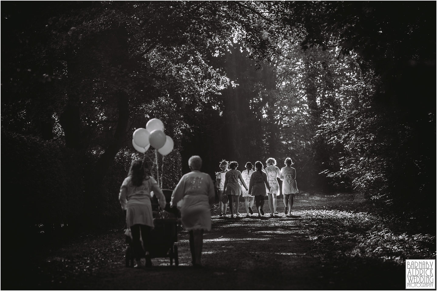 Bridesmaids walk to Saltmarshe Hall under rays of sunlight, Amazing Yorkshire Wedding Photos, Best Yorkshire Wedding Photos 2018