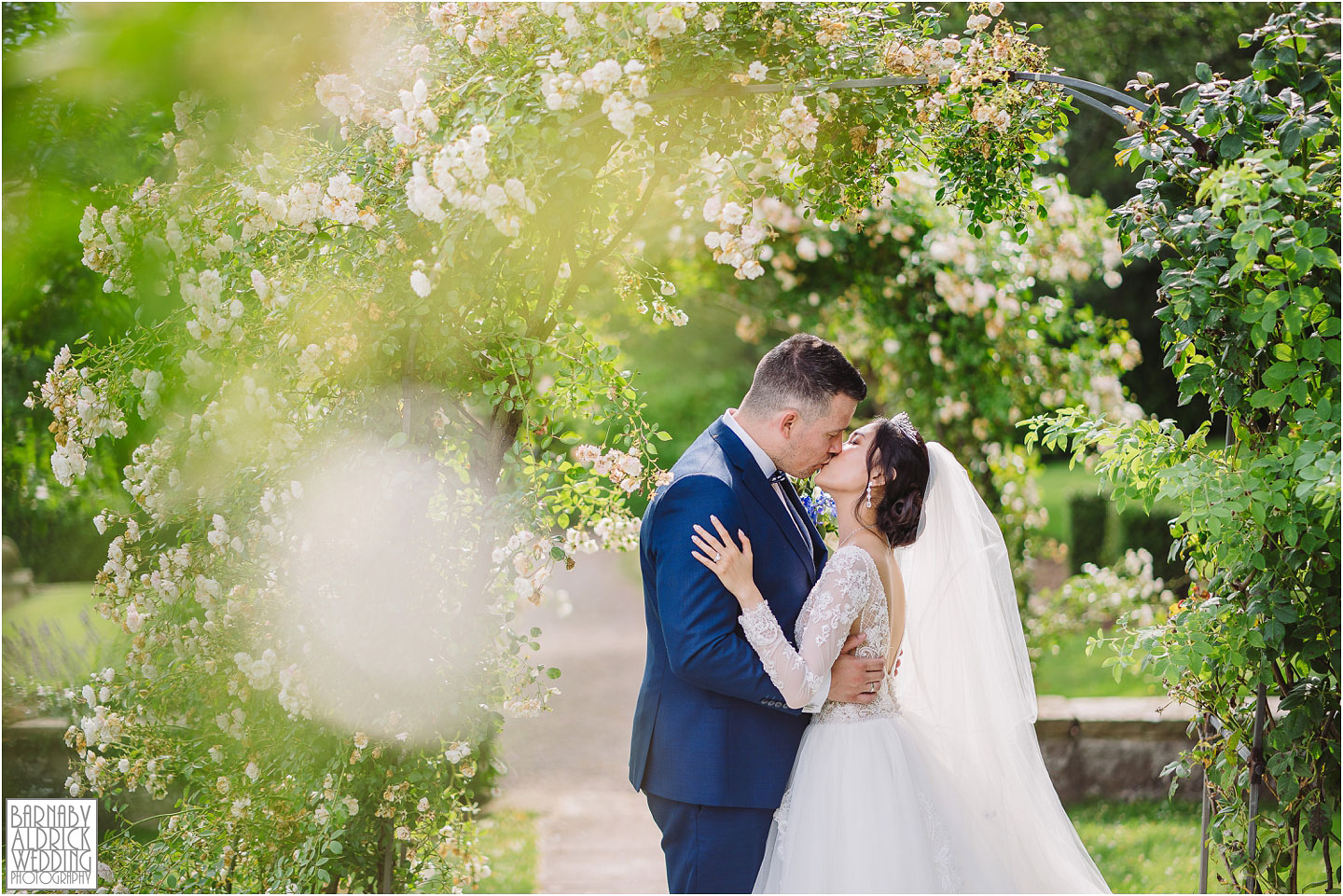 Wood Hall wetherby bride and groom kissing portrait