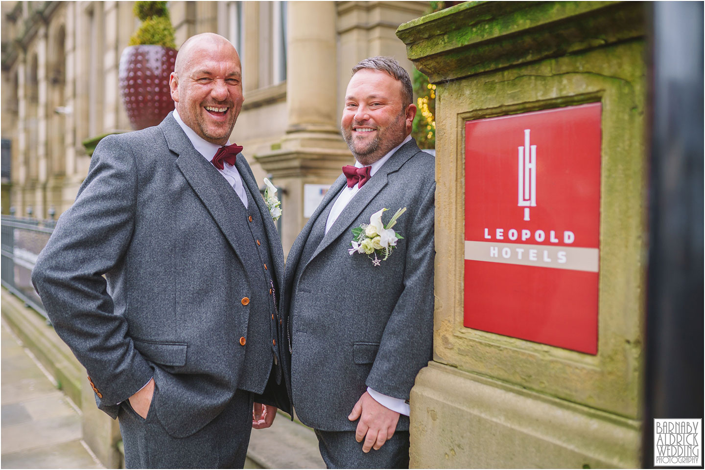 LGBTQ Wedding Photography of two grooms in grey tweed suits at The historic Cutlers Hall in Sheffield